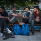 A group of men sit in Belgrade’s ‘Afghan Park’ where at least 500 asylum-seekers have been gathering daily in search of a way to enter Hungary.